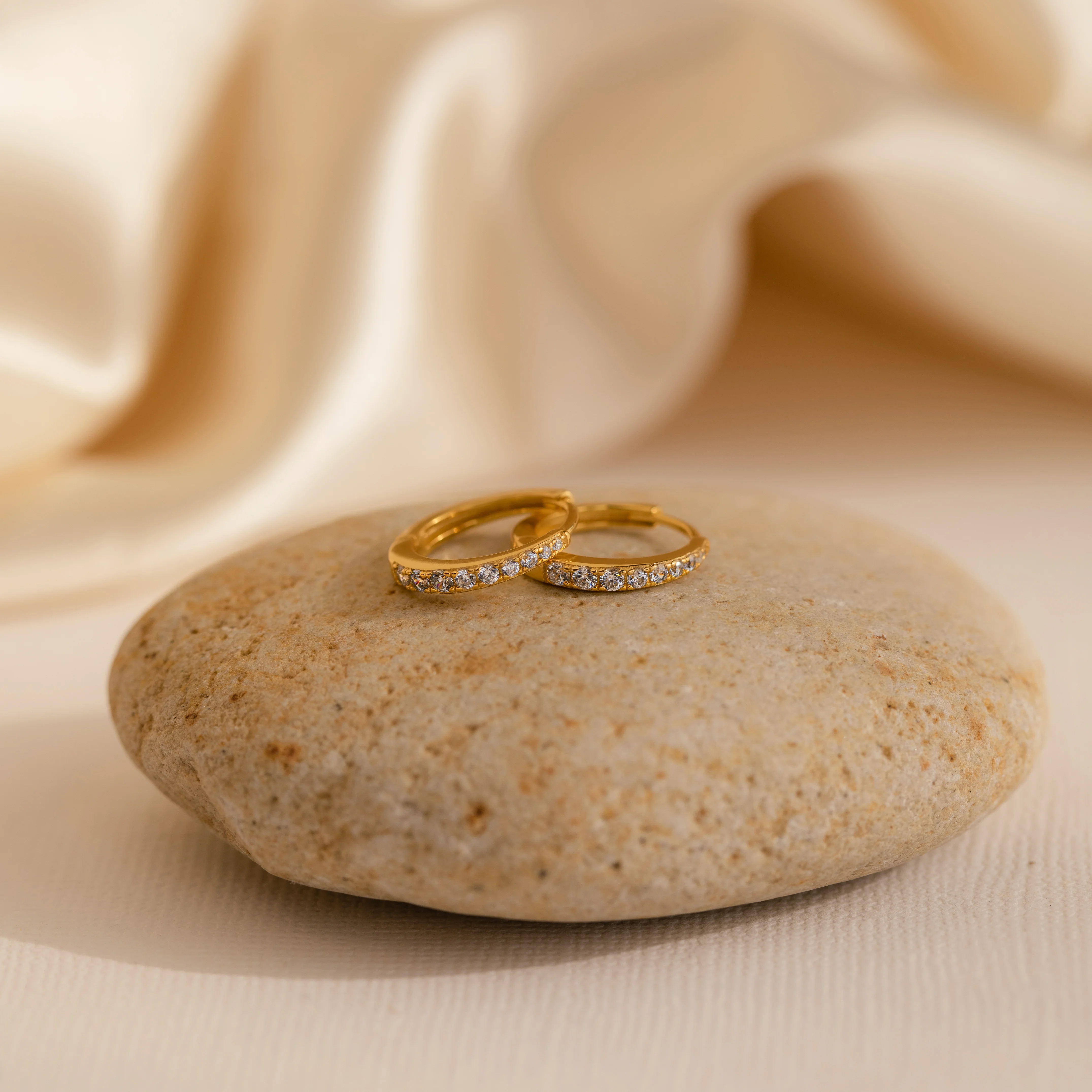 Vera Pave Peridot Huggies